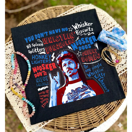 Black pillow with colorful text and graphic design on a woven surface
