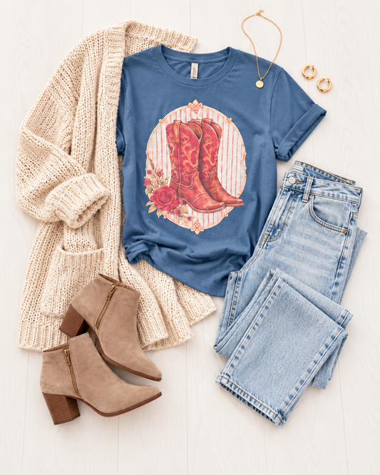 Studio A editorial flat lay of Western boots Midnight tee with jeans cream knit cardigan and ankle boots