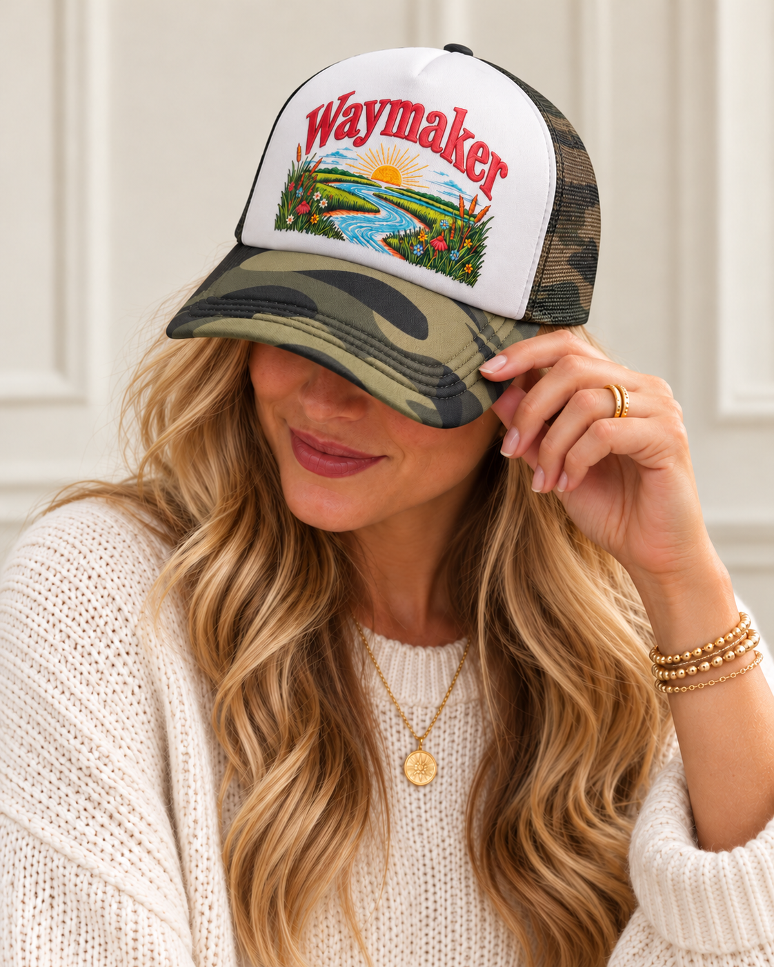 Model wearing Waymaker woodland camouflage foam-front snapback cap with white front and red Waymaker graphic