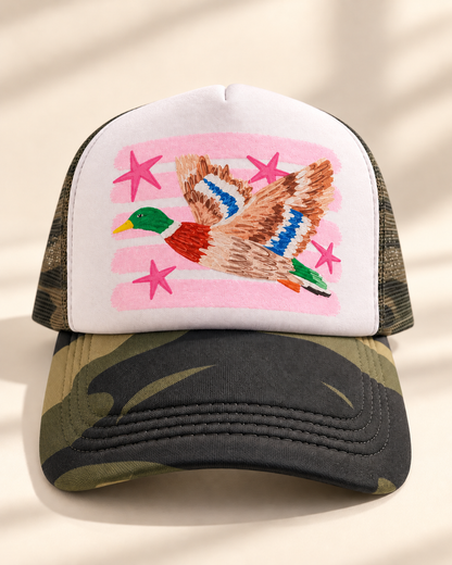 Pink mallard with pink stars on white front M81 woodland camo trucker hat