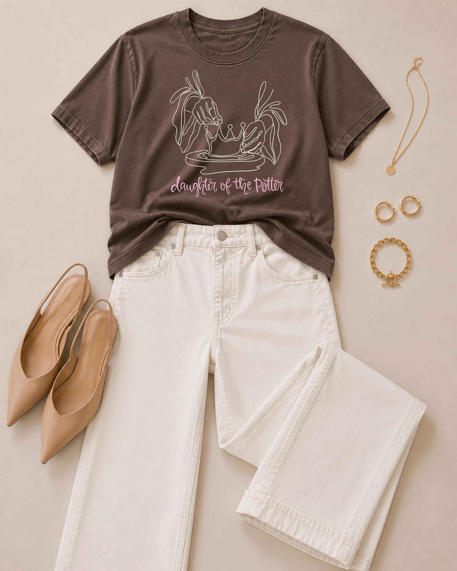 Daughter of the Potter Espresso Comfort Colors Christian tee styled with ivory wide-leg jeans, nude pointed flats, and gold jewelry.