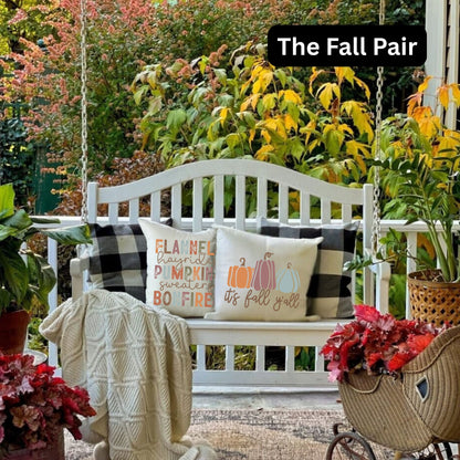 The Fall Pair | A pair of Fall themed throw pillows sitting on a chair in a living room decorated for fall