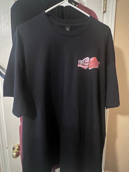Black sweatshirt with a small red and white logo on a light-colored surface