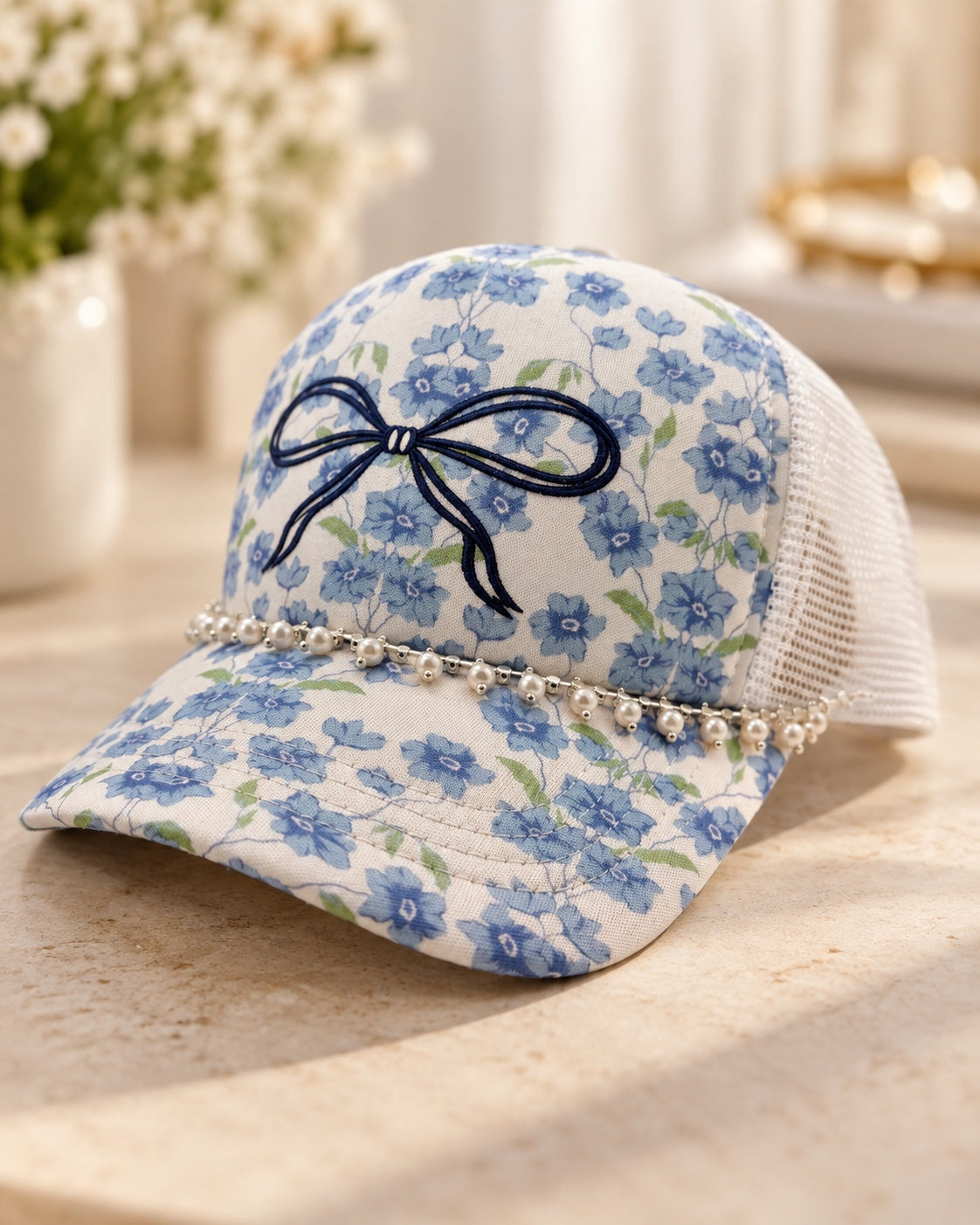 Blue floral bow pearl trim trucker hat with white mesh back