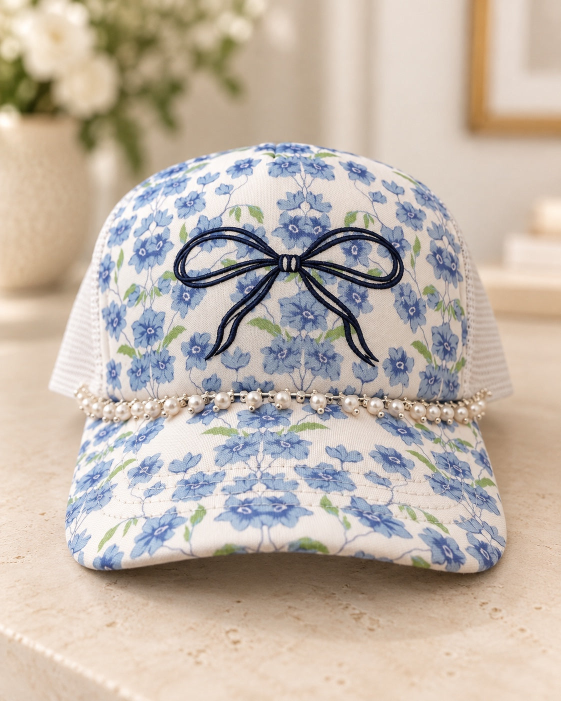 Blue floral bow and pearl trim hat front view