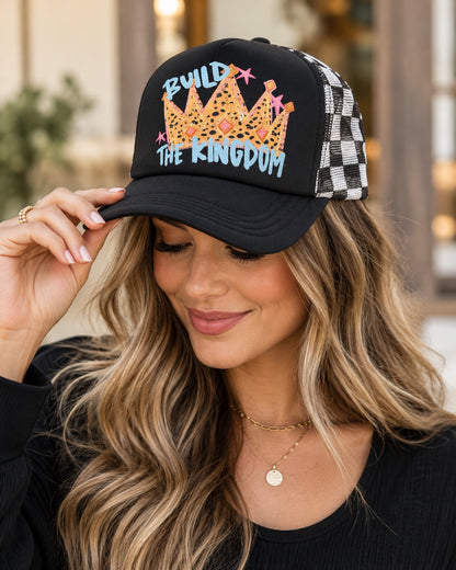 Model wearing black Build the Kingdom leopard crown snapback trucker cap with checker mesh