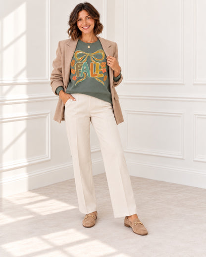 Fall coquette bow graphic sweatshirt in heather sport dark green styled with tan blazer and cream trousers