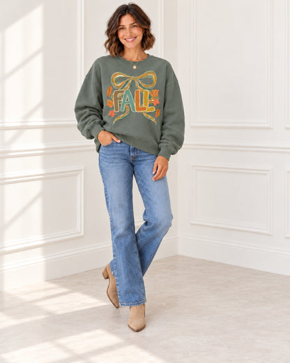 Green Fall bow sweatshirt styled casually with jeans and ankle boots