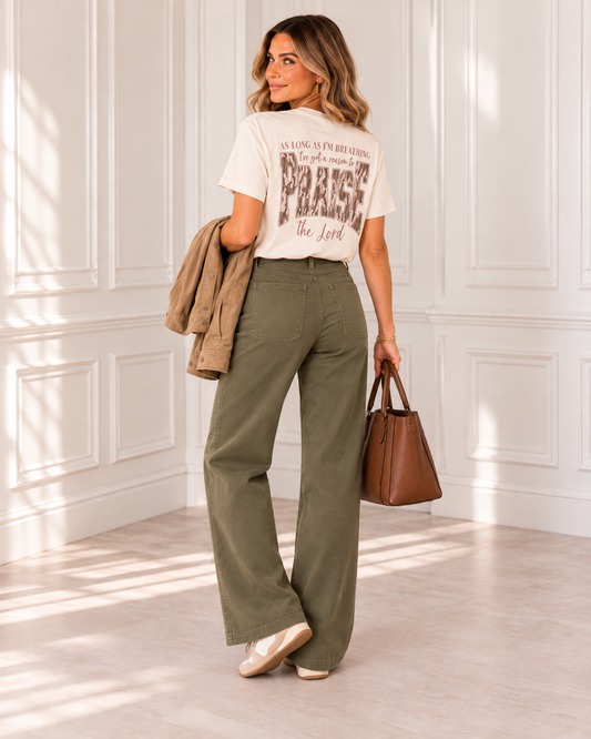 Reason to Praise tee styled flat lay with olive trousers and front detail