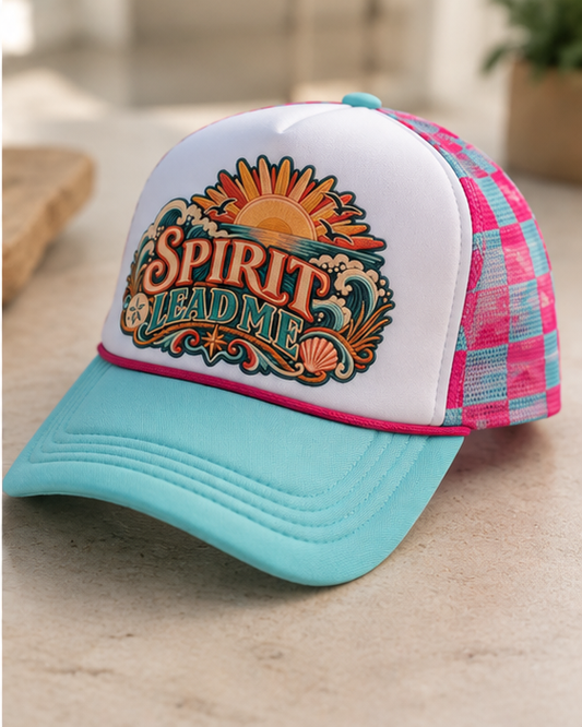 Close-up Spirit Lead Me graphic with sun ocean waves and seashells on trucker cap