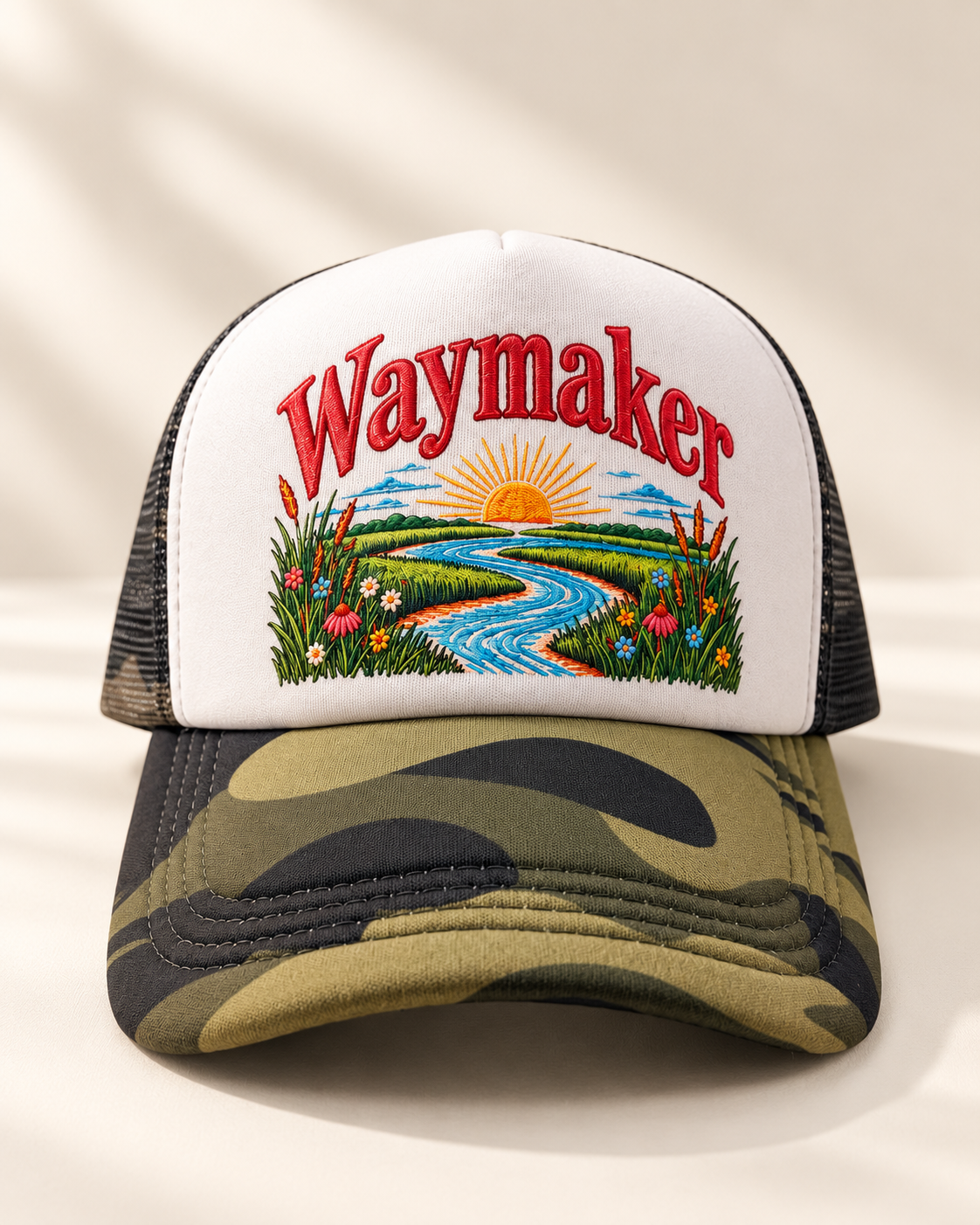 Front product photo of Waymaker Christian trucker cap with olive M81 camo bill and black mesh back
